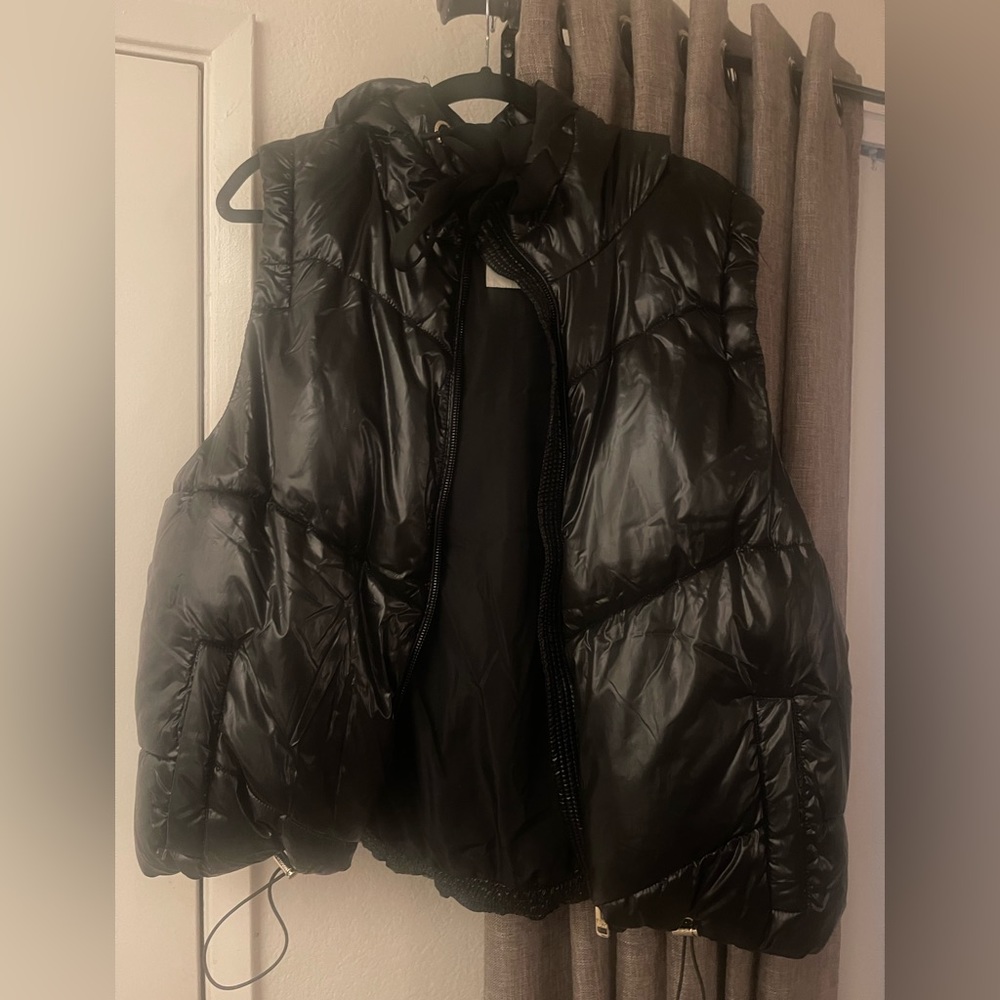 Black puffer vest.
